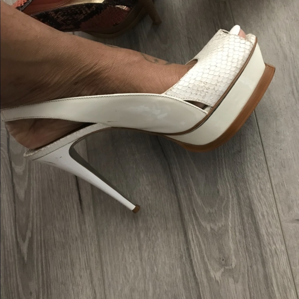 White sling back Bebe heels